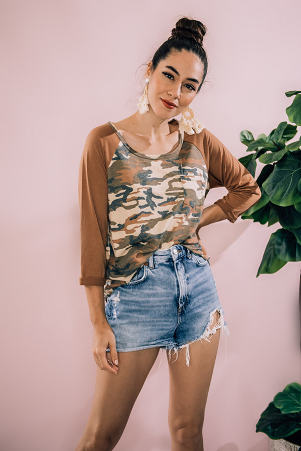 MULTI CAMO PRINT RAGLAN TOP WITH RUST COLOR SLEEVES. MODEL INFO: PIPER – SIZE 0, 5’5” WEARING A SMALL. NIKI – SIZE 14, 5’4”, WEARING A LARGE.
60% POLYESTER, 35% RAYON, 5% SPANDEX
SMALL 0-4
MEDIUM 6-10
LARGE 12-14
