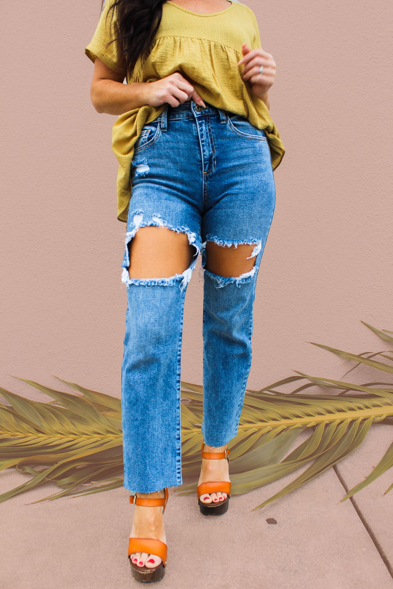 HIGH RISE, STRAIGHT FIT DENIM WITH DISTRESSING ABOVE KNEE. SOME STRETCH. 26.5 IN. INSEAM WITH RAW HEM. PREMIUM DENIM. 99% COTTON, 1% SPANDEX. STEPHANIE IS 5’4” SIZE 4 WEARING 26. AMANDA IS 5’7” SIZE 2 WEARING 26.