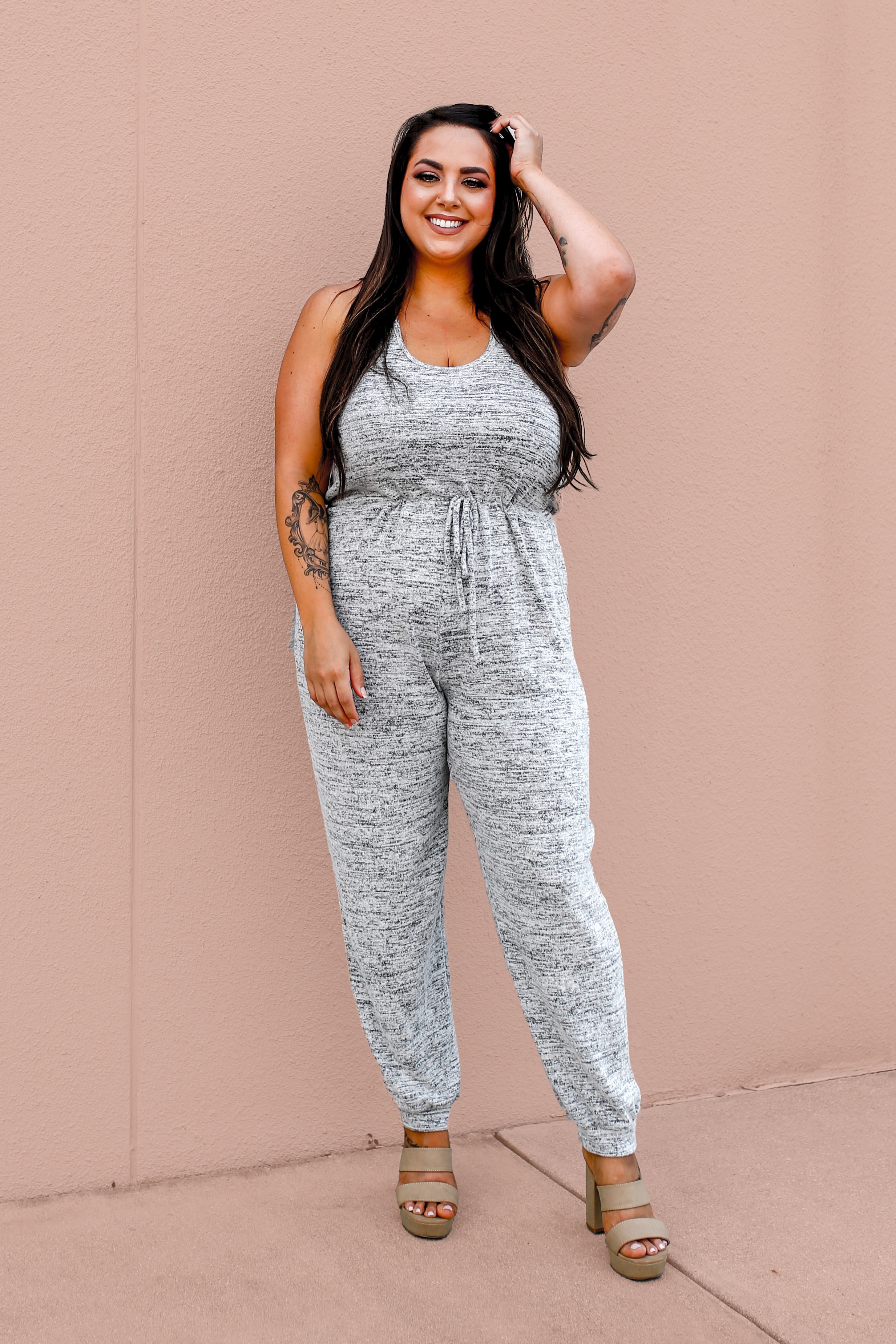 MAVERICK EXCLUSIVE! REVAMP OF THE ORIGINAL HEATH JUMPER. SUPER SOFT AND STRETCHY SWEATER FABRIC IN HEATHERED GREY. SLEEVELESS, RACERBACK. ADJUSTABLE TIE WAIST. FUNCTIONAL SIDE POCKETS. CUFFED ANKLE. 28 INCH INSEAM. 95% POLYESTER, 5% SPANDEX.