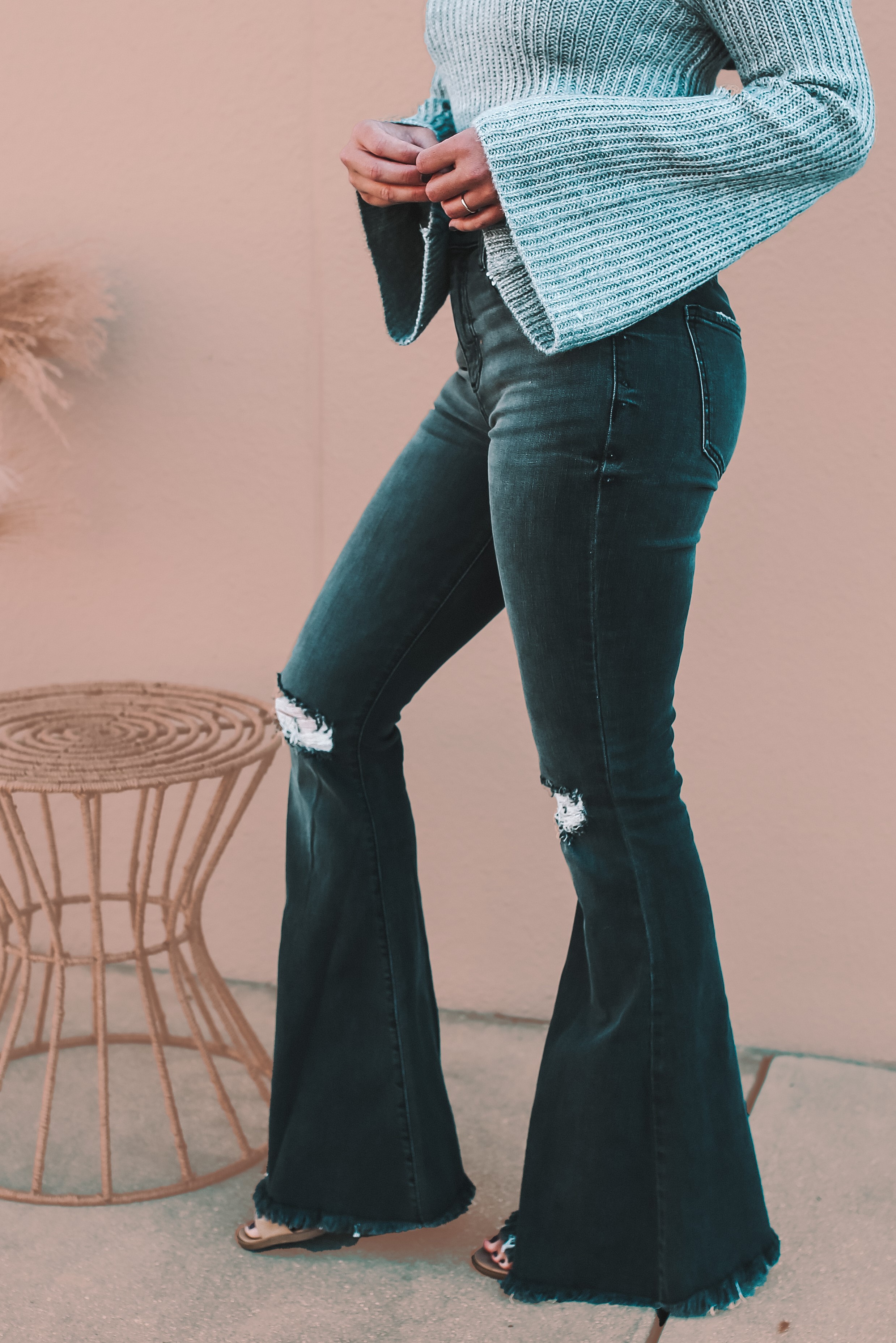 SAME CUT AS OUR BEST-SELLING WHITE BELL BOTTOMS! HIGH RISE, BLACK WASH PREMIUM DENIM. VERY SOFT AND STRETCHY. DISTRESSED KNEES AND HEM. INSEAM: 33” FOR ALL SIZES. 73% COTTON 14% RAYON 11% POLYESTER 2% SPANDEX.