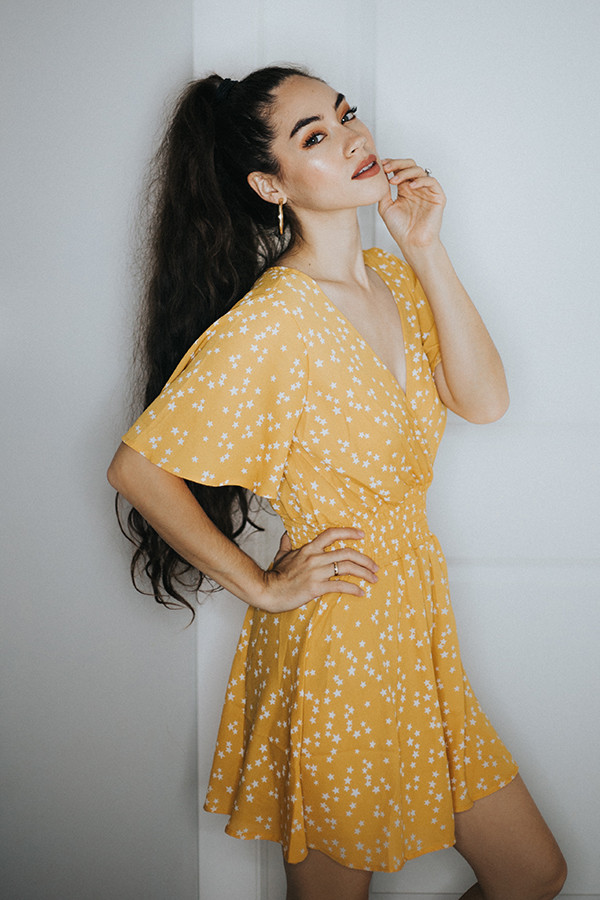 YELLOW STAR DRESS. V NECK AND AN ELASTIC WAIST ON THIS SHOW STOPPING DRESS. POLY BLEND.