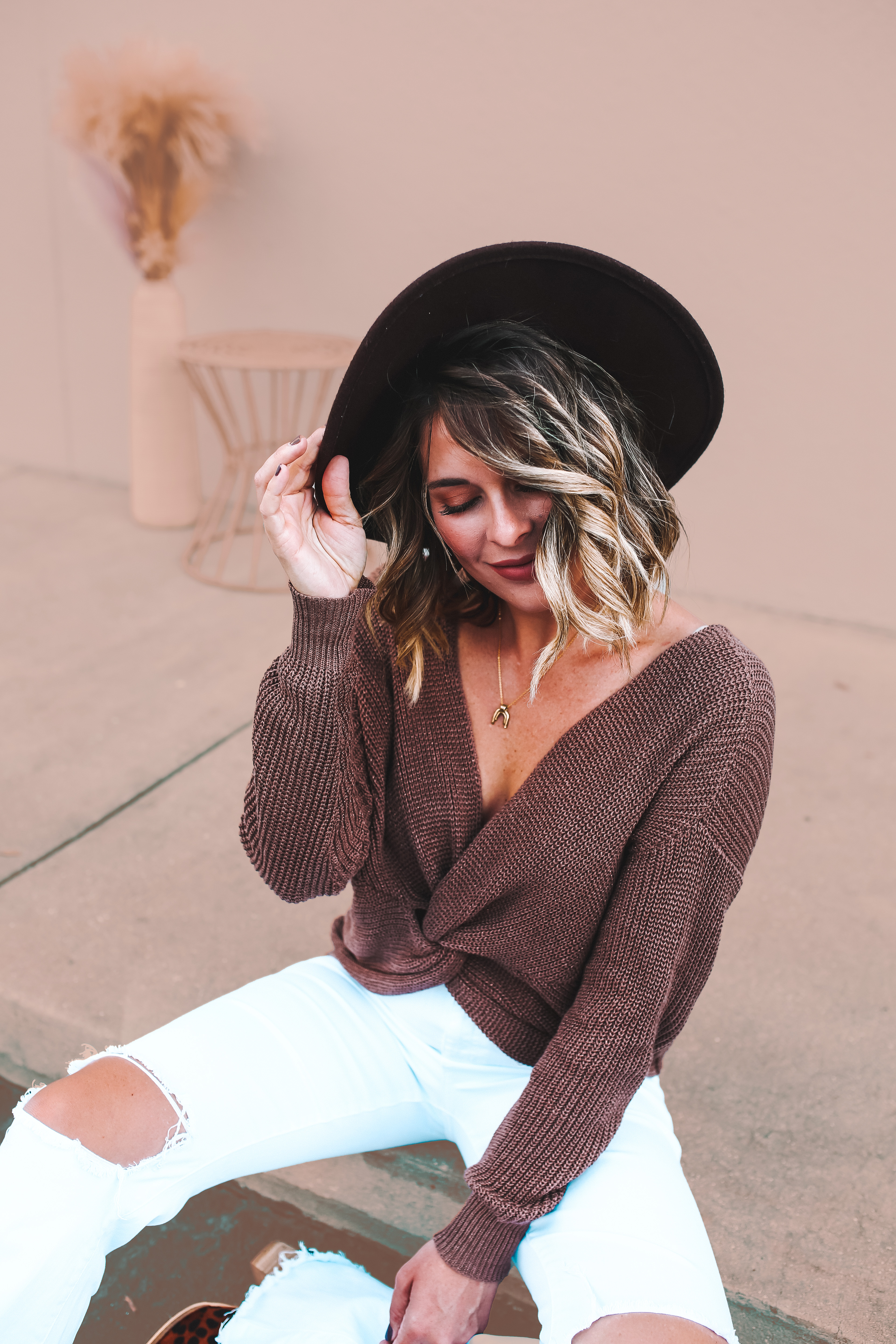 COZY KNIT SWEATER. DROP SHOULDERS AND AN OPEN TWIST BACK. CAN BE WORN BACKWARDS FOR TWIST FRONT. SLIGHTLY THINNER THAN PREVIOUS BENNETT COLORS, BITS OF METALLIC GOLD THREAD THROUGHOUT. 94% COTTON 5% POLYESTER 1% METALLIC.