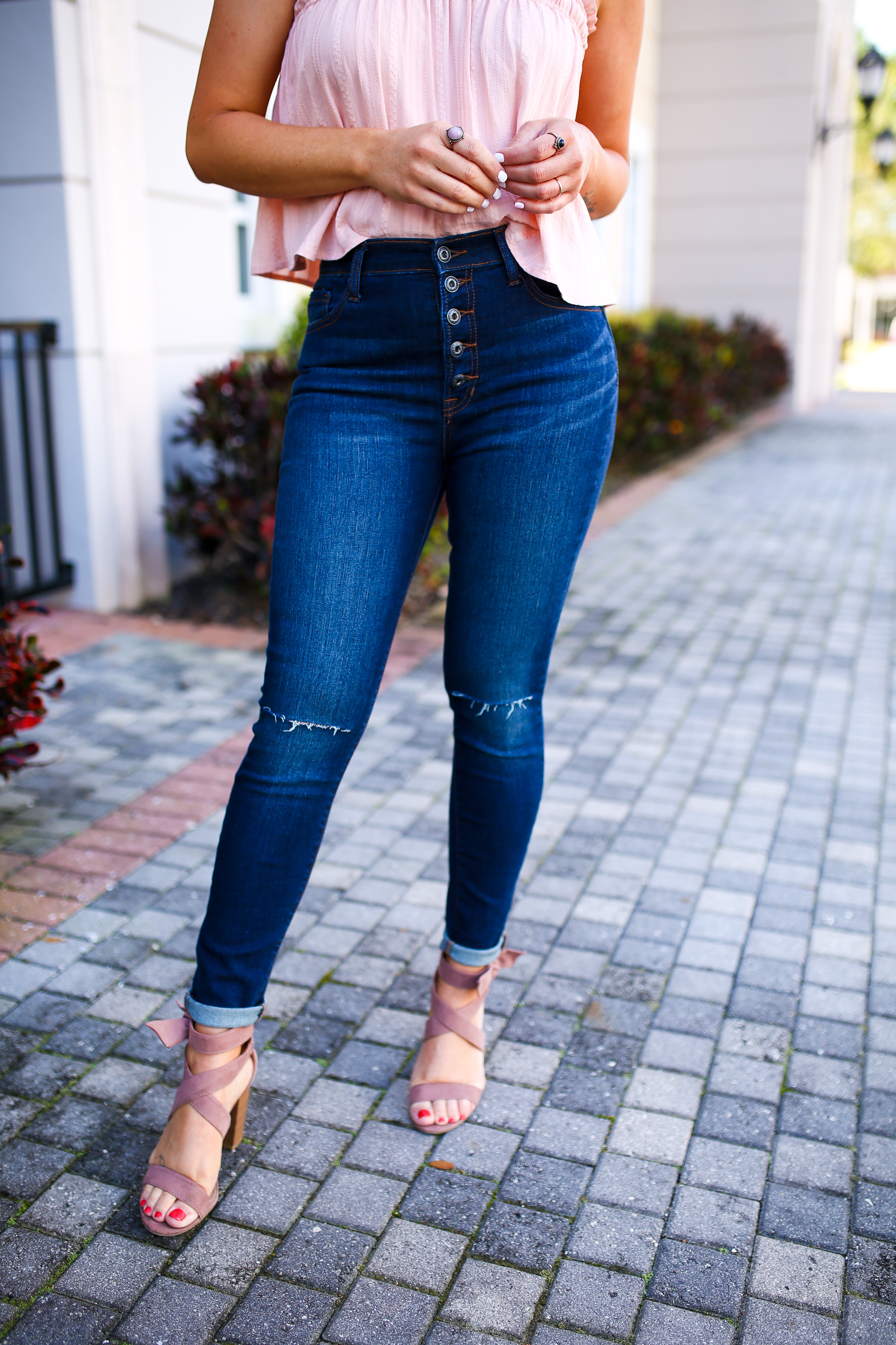 DARK WASH, HIGH RISE SKINNY DENIM. FEATURING A 5 BUTTON FLY, FLATTERING THIGH WASHING AND LIGHT DISTRESSING AT THE KNEES. 28in. INSEAM. 73% COTTON, 14% RAYON, 11% POLYESTER, 2% SPANDEX. AMANDA IS 5’6” SIZE 2 WEARING 26. GABBY IS 5’8” SIZE 12 WEARING 31.