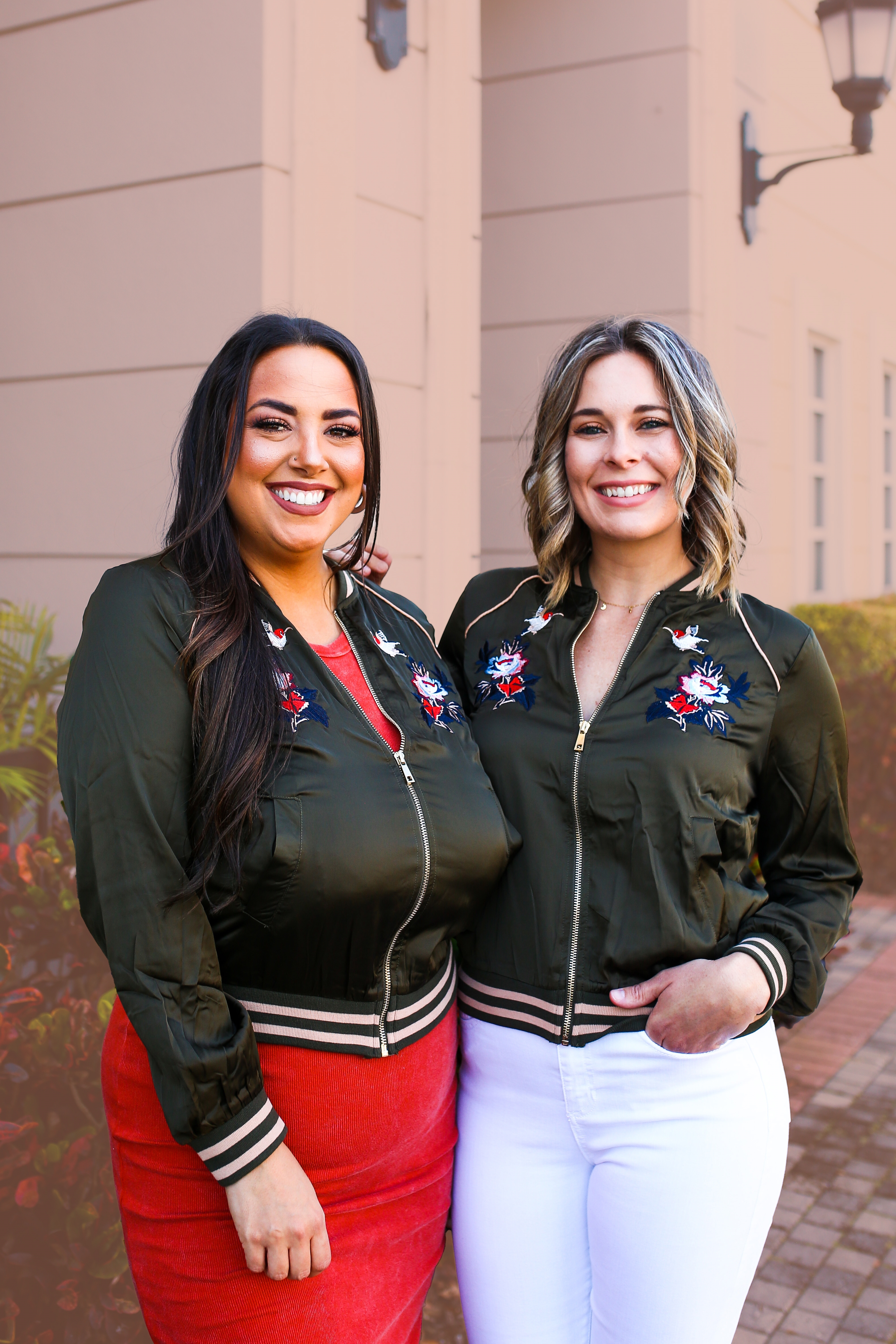LIGHTWEIGHT SILK-FEEL FABRIC JACKET. OLIVE GREEN WITH TAN DETAIL AND GOLD ZIPPER. EMBROIDERY DETAIL ON FRONT. FUNCTIONAL SIDE POCKETS. STRETCHY ELASTIC WAIST AND CUFFS. 100% RAYON. AMANDA IS 5’7 SIZE 2 WEARING SMALL, GABBY IS A SIZE 12 WEARING LARGE.