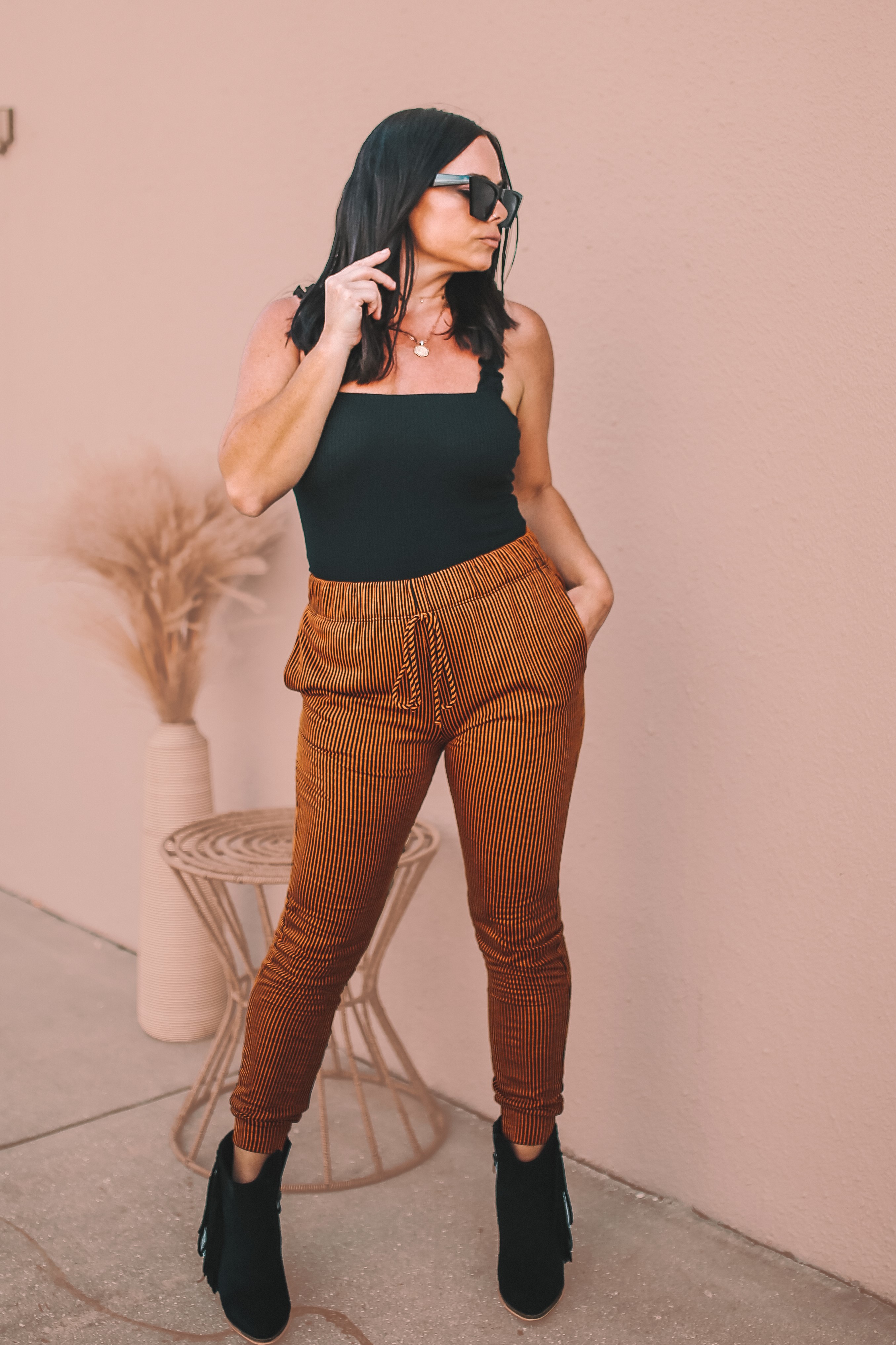 MAVERICK EXCLUSIVE! JOGGER STYLE PANTS. VERY SOFT. ELASTIC WAIST AND CUFF, BLACK AND CAMEL STRIPED. 49.5% POLY, 46.5% RAYON, 4% SPANDEX. AMANDA IS 5’7 SIZE 2, WEARING A SMALL. GABBY IS SIZE 10/12 WEARING XL. RUNS A TAD TIGHTER THAN CORAL COLOR.