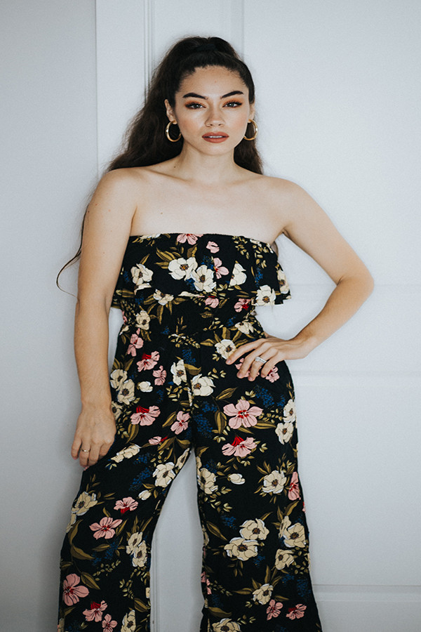 BLACK FLORAL JUMPER. THIS STRAPLESS JUMPER HAS SOME STRETCH ON THE TOP AND HAS A STYLISH WIDER LEG THAT IS CROPPED A LITTLE