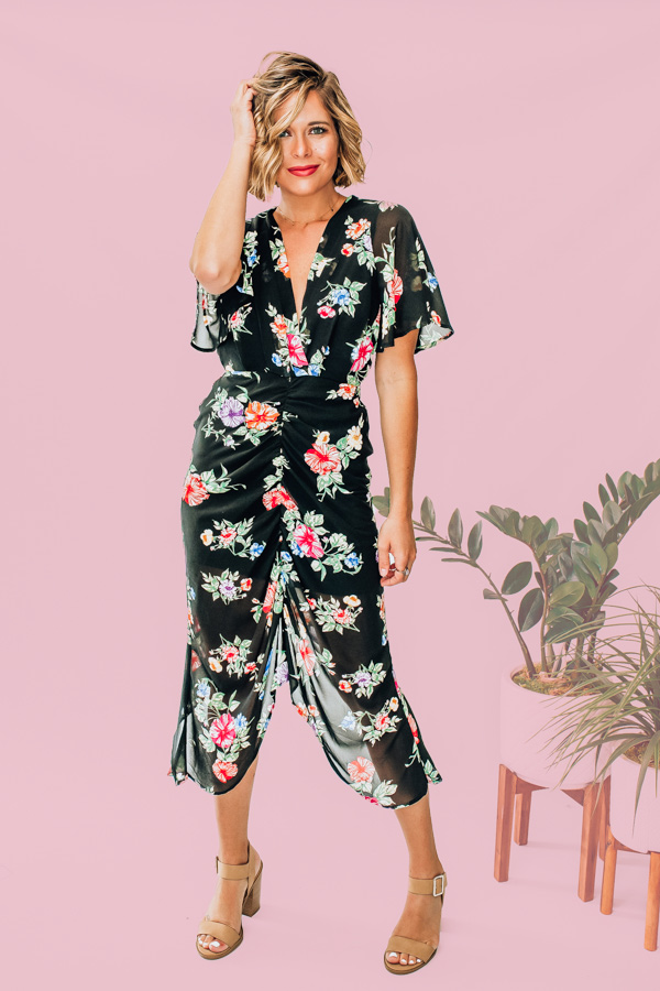 BLACK BACKGROUND WITH MULTICOLOR FLORAL PRINT. BODYCON FIT WITH LINING. FLOWY SLEEVES AND V NECK. FRONT AND BACK SLITS. ROUCHING DEATIL ON FRONT. HALF ZIP BACK WITH TOP BUTTON. MATERIAL IS NOT STRETCHY. 100% POLYESTER. AMANDA IS A SIZE 2, WEARING A SMALL.