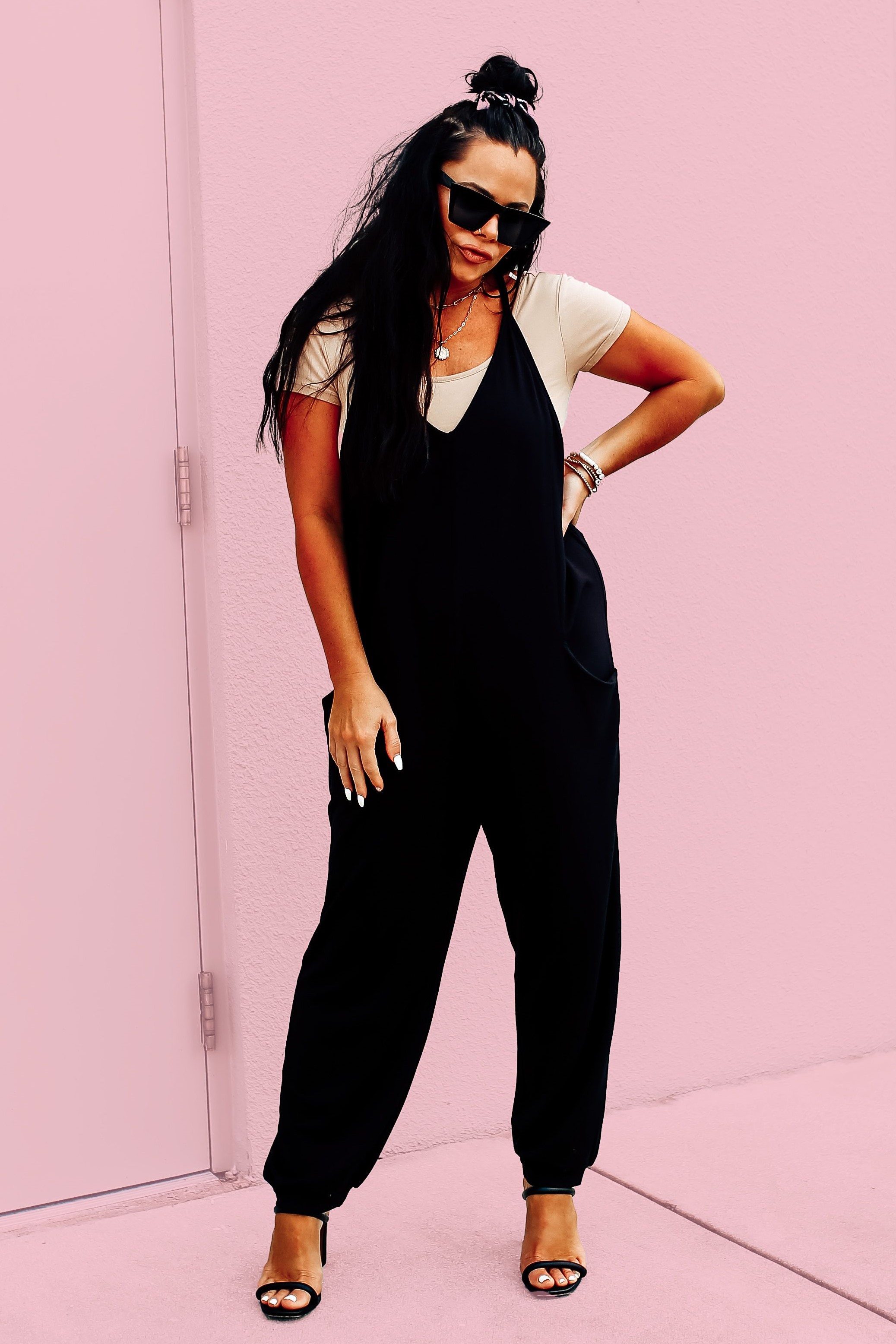EXCLUSIVE TO MAVERICK! SLEEVELESS BLACK JUMPSUIT. OVERSIZED BOHO STYLE. V-NECK CUT, FUNCTIONAL SIDE POCKETS. LOOSE CUFFED ANKLE. VERY SOFT AND STRECHY. 95% POLYESTER, 5% SPANDEX.