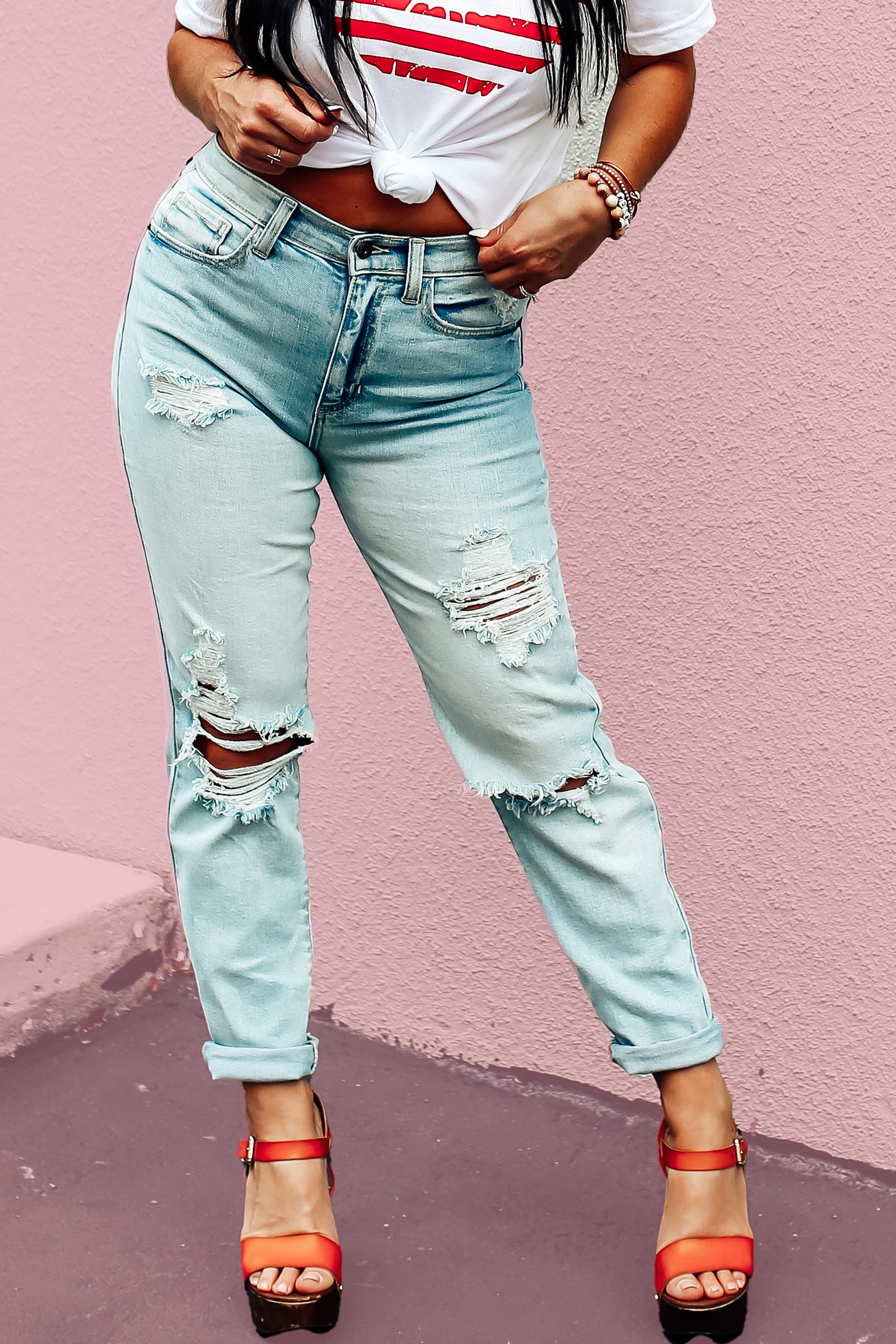 PREMIUM DENIM IN A LIGHT WASH. LOTS OF DISTRESSING. LOOSE, BOYFRIEND STYLE FIT. 29 IN. INSEAM. 99% COTTON, 1% SPANDEX. AMANDA IS 5’7” A SIZE 2, WEARING A 26. STEPHANIE IS 5’4” SIZE 4 WEARING A 26.