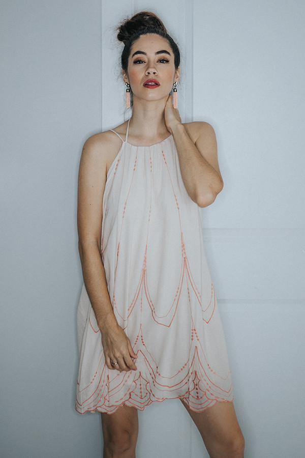 CREAM/PEACH DRESS WITH TIE AROUND THE NECK.
SPAGHETTI STRAPS. 100% RAYON